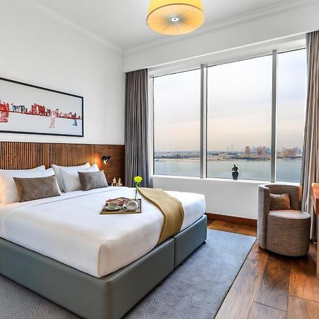 Somerset West Bay Doha Bagian luar foto A bedroom at the hotel