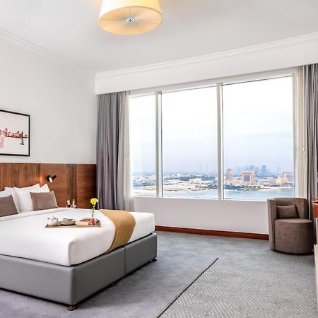 Somerset West Bay Doha Bagian luar foto A bedroom at the hotel