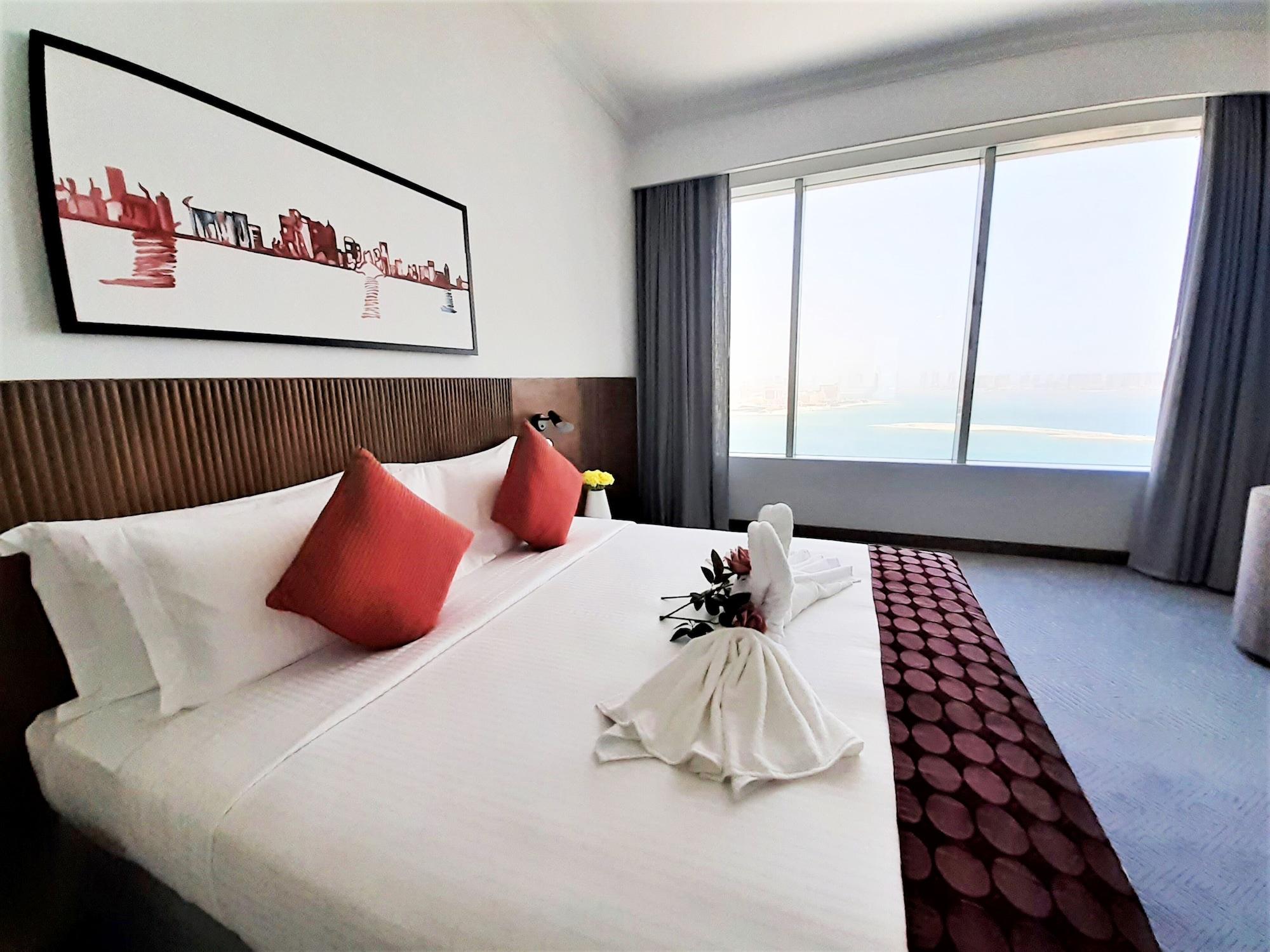 Somerset West Bay Doha Bagian luar foto Deluxe Room