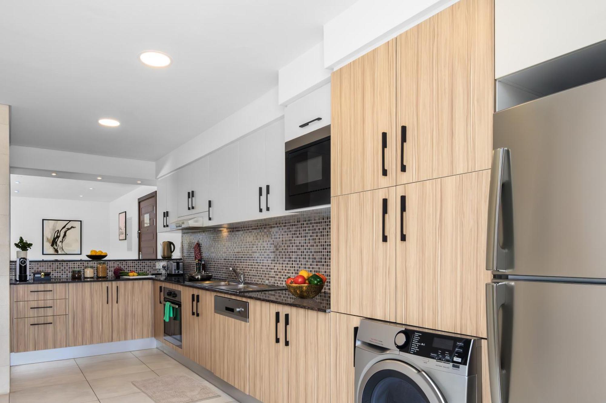 Somerset West Bay Doha Bagian luar foto A kitchen at The Standard East Village